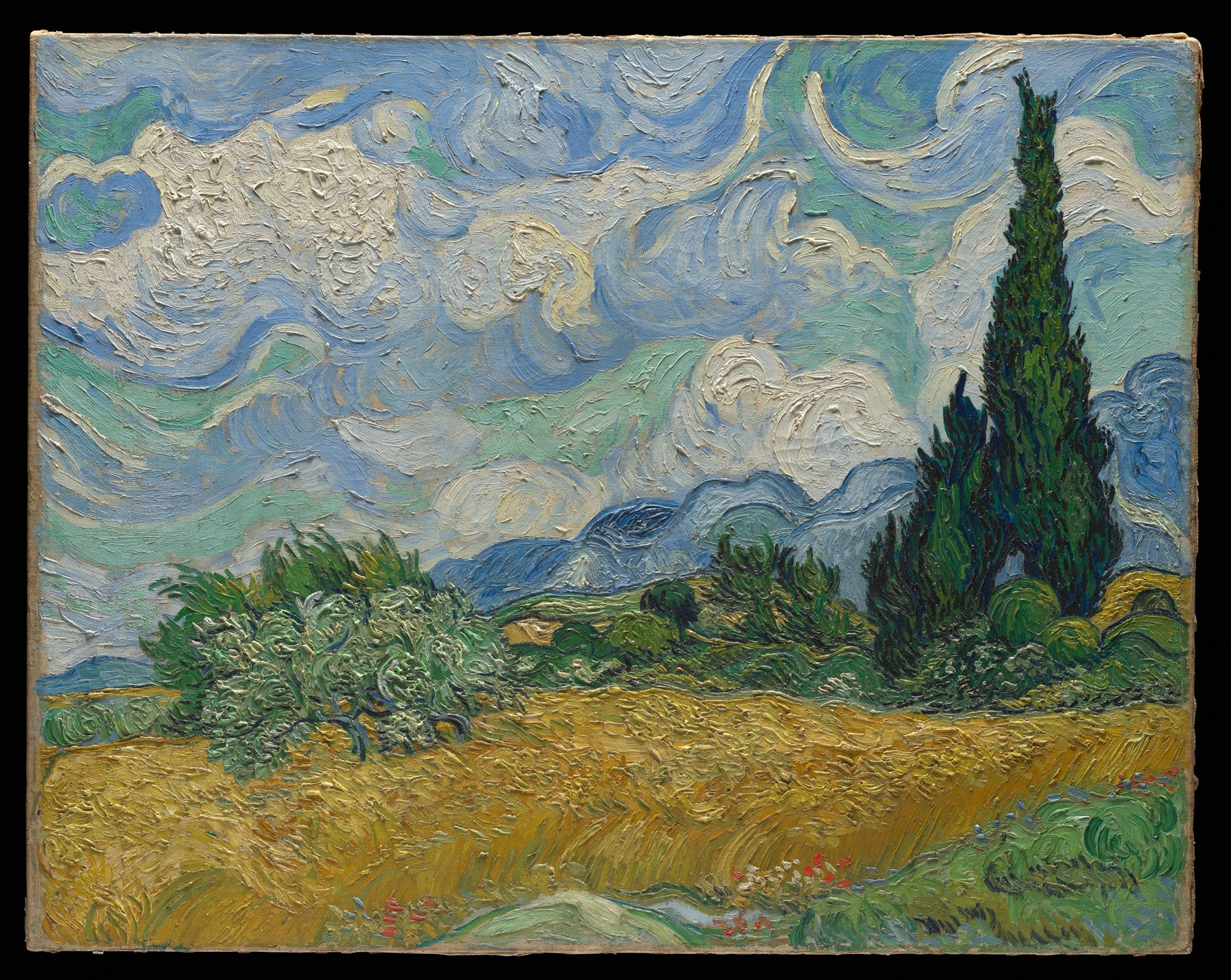 A turbulent blue sky moves over a gold wheat field and two dark cypress trees in a painting by Vincent van Gogh.